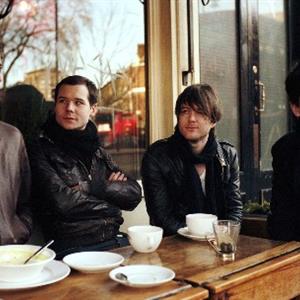 Photo of the band at a cafe.